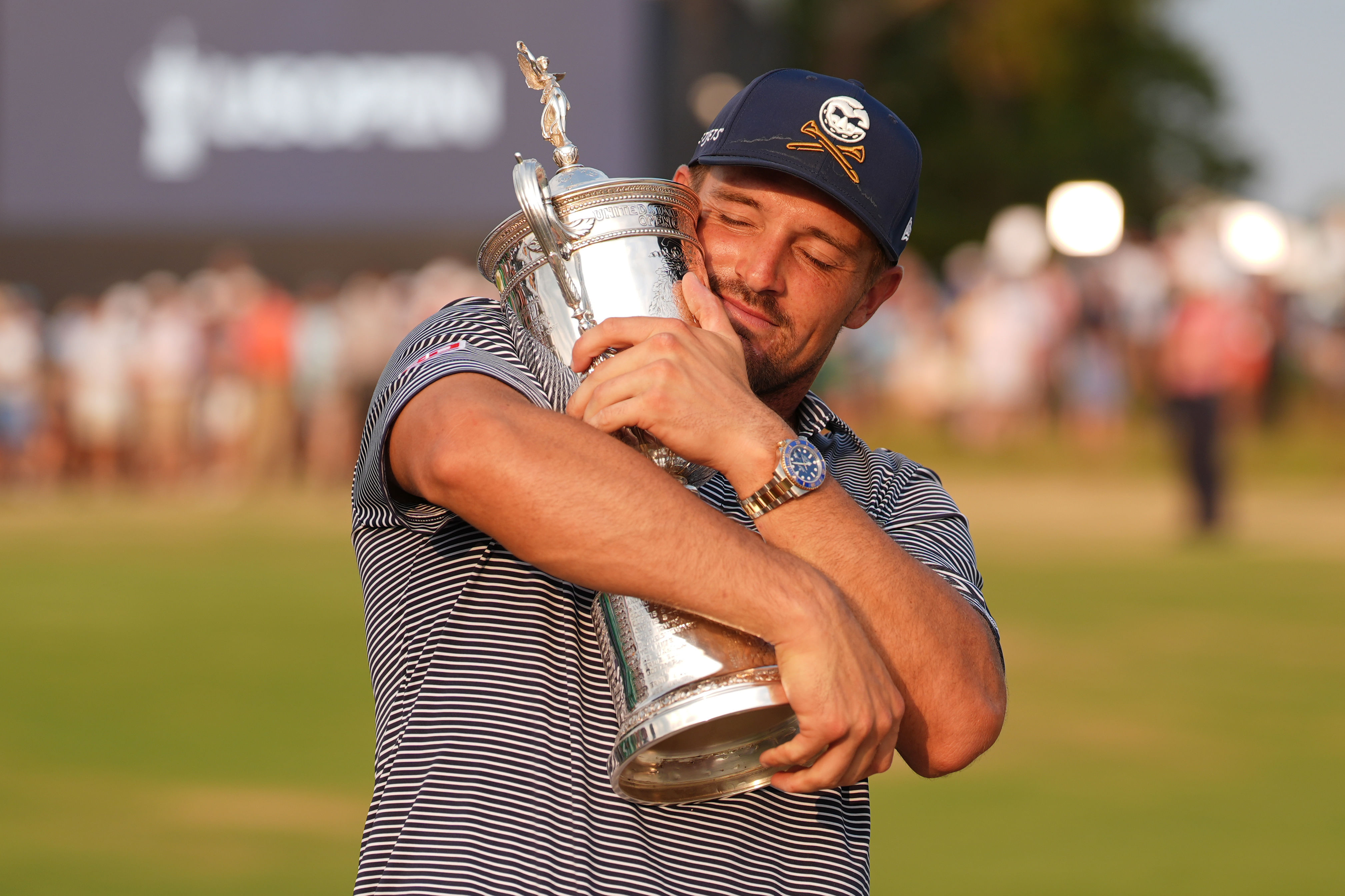 Bryson DeChambeau lifts the 2024 US Open Trophy at Pinehurst Resort - Image Source: Imagn